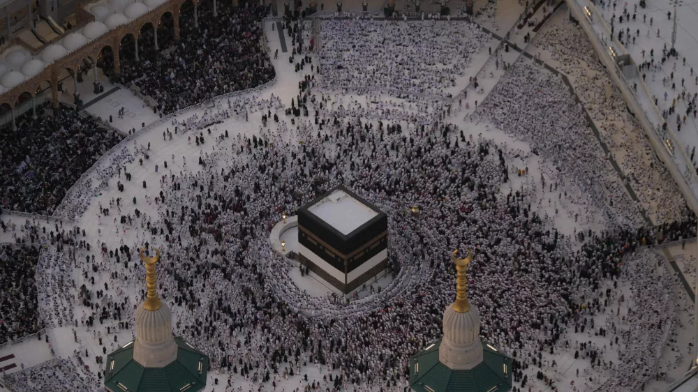 Muslim pilgrims circumambulate the Kaaba, Islam's holiest site, at the Grand Mosque, during the annual Hajj pilgrimage in Mecca, Saudi Arabia, Sunday, May 24, 2026. (AP Photo/Altaf Qadri)