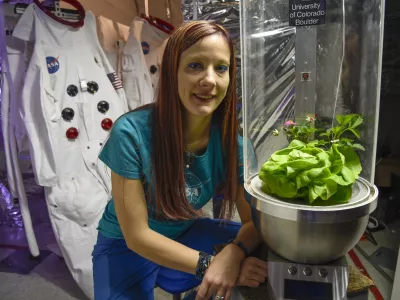 BOULDER, CO - APRIL 12: Heather Hava, a 'space gardener,' picked up an MIT award for her research. She's is also working on growing plants in space that not only will offer nutrients but improve astronauts' happiness. Here she stands with her invention SPOT April 12, 2016 a self-contained planting container where plants will grow. The plants in this photo were placed there to show what the container will look like when plants are growing. (Photo By John Leyba/The Denver Post via Getty Images)
