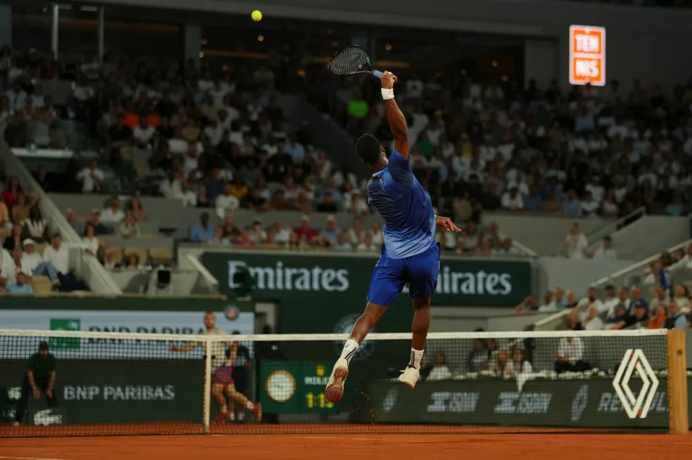 Gael Monfils of France returns to Hugo Gaston of France during their first round men's singles tennis match at the French Open tennis tournament in Paris, Monday, May 25, 2026. (AP Photo/Aurelien Morissard)