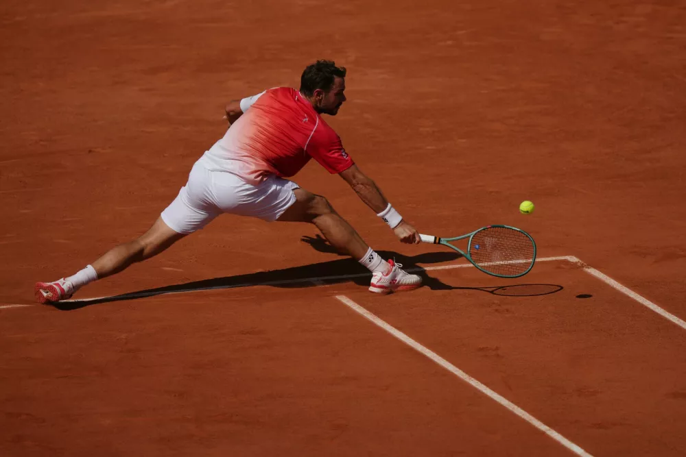Stan Wawrinka of Switzerland returns to Jesper De Jong of the Netherlands during their first round men's singles tennis match at the French Open tennis tournament in Paris, Monday, May 25, 2026. (AP Photo/Aurelien Morissard)