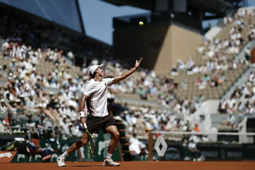 Tennis - French Open - Roland Garros, Paris, France - May 26, 2026 Australia's Adam Walton serves during his first round match against Russia's Daniil Medvedev REUTERS/Benoit Tessier