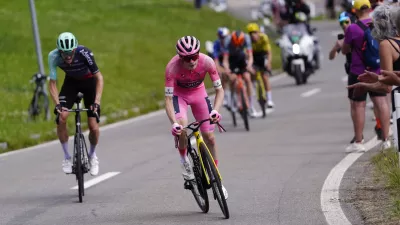 Denmark's Jonas Vingegaard wears the pink jersey of the race overall leader on his way to win the 16th stage of the Giro d'Italia cycling race from Bellinzona to Cari', Switzerland, Tuesday May 26, 2026 (Fabio Ferrari/LaPresse via AP)
