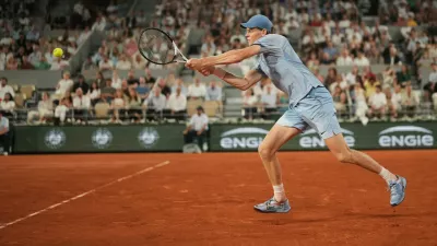Jannik Sinner of Italy returns to Clement Tabur of France during their first round men's singles tennis match at the French Open tennis tournament in Paris, Tuesday, May 26, 2026. (AP Photo/Thibault Camus)
