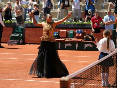 Naomi Osaka of Japan gestures before the first round women's singles tennis match against Laura Siegemund of Germany at the French Open tennis tournament in Paris, Tuesday, May 26, 2026. (AP Photo/Aurelien Morissard)