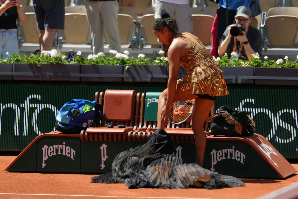 Naomi Osaka of Japan prepares for the first round women's singles tennis match against Laura Siegemund of Germany at the French Open tennis tournament in Paris, Tuesday, May 26, 2026. (AP Photo/Aurelien Morissard)