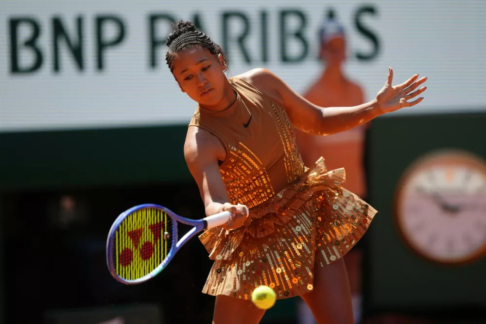 Naomi Osaka of Japan warms up before the first round women's singles tennis match against Laura Siegemund of Germany at the French Open tennis tournament in Paris, Tuesday, May 26, 2026. (AP Photo/Aurelien Morissard)