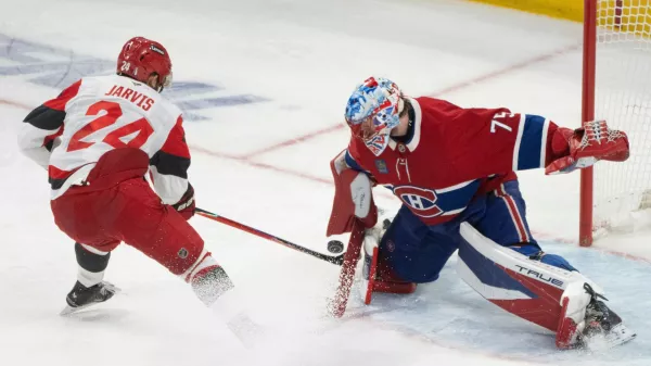 Montreal Canadiens goaltender Jakub Dobes (75) makes a save against Carolina Hurricanes' Seth Jarvis (24) during third period of Game 4 of the NHL Eastern Conference final Stanley Cup playoff series game in Montreal on Wednesday, May 27, 2026. (Christinne Muschi/The Canadian Press via AP)