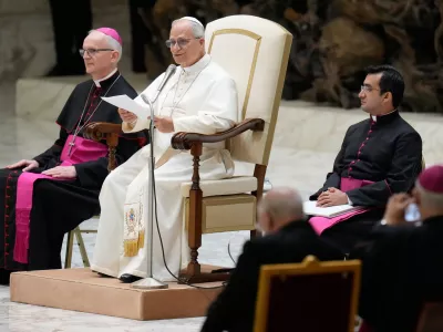 Pope Leo XIV delivers his message as he meets with members of the Catholic Charismatic Renewal movement in the Paul VI Hall at the Vatican, Saturday, May 30, 2026. (AP Photo/Gregorio Borgia)