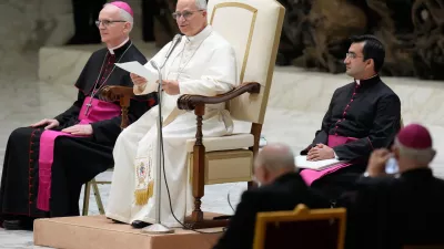 Pope Leo XIV delivers his message as he meets with members of the Catholic Charismatic Renewal movement in the Paul VI Hall at the Vatican, Saturday, May 30, 2026. (AP Photo/Gregorio Borgia)