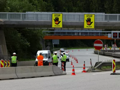 Police officers divert a car, as the Brenner motorway is closed on the day protestors demonstrate against the growing traffic load, near Schoenberg, Austria, May 30, 2026. REUTERS/Christian Mang