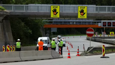 Police officers divert a car, as the Brenner motorway is closed on the day protestors demonstrate against the growing traffic load, near Schoenberg, Austria, May 30, 2026. REUTERS/Christian Mang