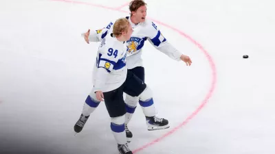 Ice Hockey - IIHF World Championships - Gold Medal Game - Switzerland v Finland - Swiss Life Arena, Zurich, Switzerland - May 31, 2026 Finland's Konsta Helenius celebrates scoring their first goal in overtime with Anton Lundell REUTERS/Denis Balibouse
