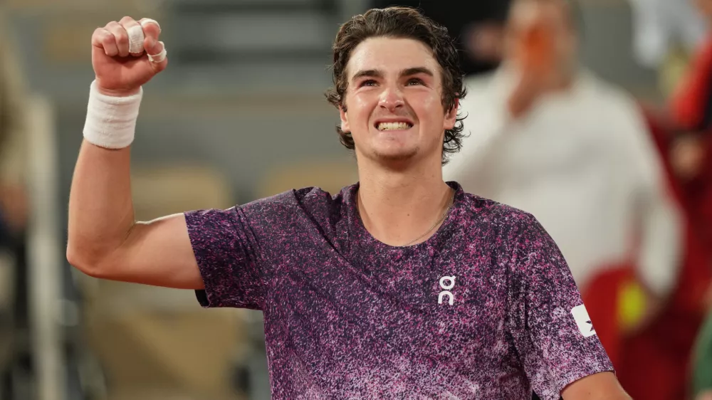 Brazil's Joao Fonseca reacst after winning the fourth-round tennis match against Norway's Casper Ruud at the French Open in Paris, Monday, June 1, 2026. (AP Photo/Thibault Camus)