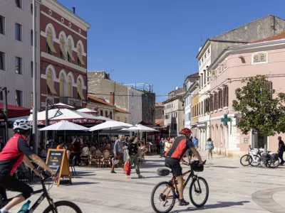 Porec, Croatia, Istria - September 25, 2023: People in Freedom Square (Trg Slobode) in Old Town, the largest and most popular square in the city