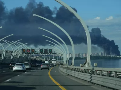 A plume of black smoke is seen over the port of St. Petersburg, Russia, Wednesday, June 3, 2026, after a Ukrainian drone attack. (AP Photo)