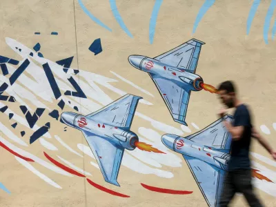 An Iranian man walks next to an anti-Israeli mural on a street in Tehran, Iran June 6, 2026. Majid Asgaripour/WANA (West Asia News Agency) via REUTERS  ATTENTION EDITORS - THIS PICTURE WAS PROVIDED BY A THIRD PARTY. ISRAEL OUT. NO COMMERCIAL OR EDITORIAL SALES IN ISRAEL. NO ACCESS FOR ISRAELI MEDIA. NO USE BBC PERSIAN. NO USE VOA PERSIAN. NO USE MANOTO. NO USE IRAN INTERNATIONAL. NO USE RADIO FARDA. DIGITAL: NO USE BBC PERSIAN. NO USE VOA PERSIAN. NO USE MANOTO. NO USE IRAN INTERNATIONAL. NO USE RADIO FARDA.