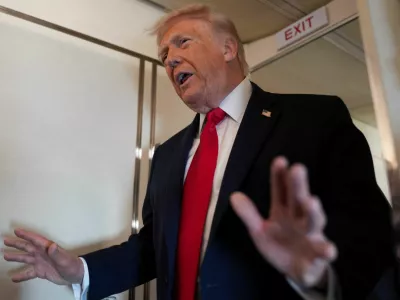 U.S. President Donald Trump speaks to members of the media on board Air Force One while flying from Joint Base Andrews to Chippewa Valley Regional Airport in Eau Claire, Wisconsin, U.S., June 5, 2026. REUTERS/Nathan Howard