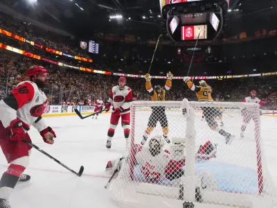 Carolina Hurricanes left wing Jordan Martinook (48) reacts after Vegas Golden Knights defenseman Shea Theodore scored during the the second overtime in Game 3 of the NHL hockey Stanley Cup Final series, Saturday, June 6, 2026, in Las Vegas. (AP Photo/Candice Ward)