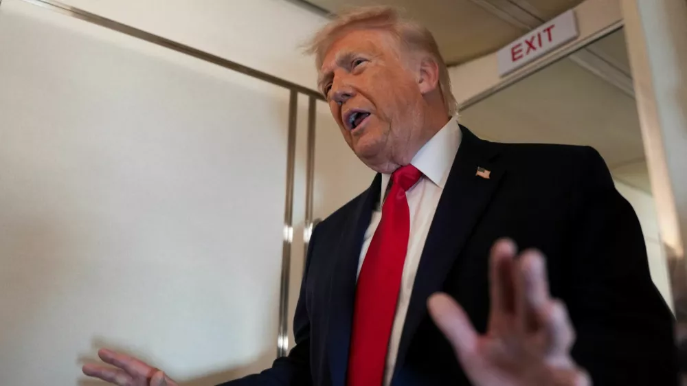 U.S. President Donald Trump speaks to members of the media on board Air Force One while flying from Joint Base Andrews to Chippewa Valley Regional Airport in Eau Claire, Wisconsin, U.S., June 5, 2026. REUTERS/Nathan Howard