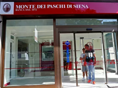 FILE PHOTO: People are seen inside a Monte dei Paschi di Siena bank in Rome, Italy August 16, 2018. REUTERS/Max Rossi/File Photo