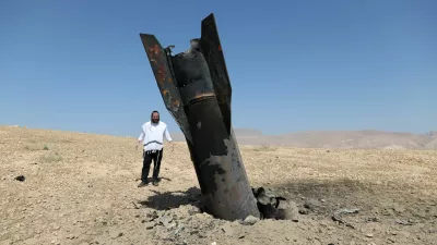 An Israeli ultra-Orthodox Jewish man reacts near a part of a missile protruding from the ground, following strikes from Iran, in the central Israeli-occupied West Bank, June 8, 2026. REUTERS/Ammar Awad