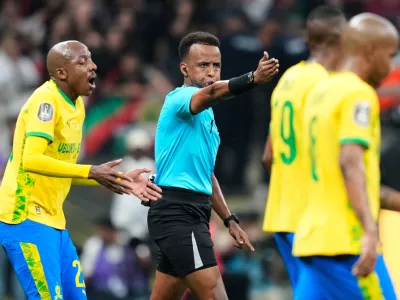 FILE - Referee Omar Artan, center, signals a penalty during the CAF Champions League final soccer match between AS FAR Rabat and Mamelodi Sundowns, in Rabat, Morocco, Sunday, May 24, 2026. (AP Photo/Mosa'ab Elshamy, File)