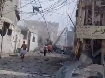 People inspect the damage in the aftermath of an Israeli strike, in Tyre, Lebanon, June 9, 2026, in this screen grab taken from a social media video. Social Media/via REUTERS THIS IMAGE HAS BEEN SUPPLIED BY A THIRD PARTY. NO RESALES. NO ARCHIVES. NEWS USE ONLY. VERIFICATION: - Buildings, road layout, power pylons and trees matched satellite imagery. - Coordinates: 33.26896776549794, 35.22009307638538. - Date verified by a report from the Lebanese National News Agency of airstrikes that hit several residential buildings in Tyre on the morning of June 9. - No older versions found posted online before June 9.