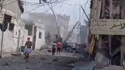 People inspect the damage in the aftermath of an Israeli strike, in Tyre, Lebanon, June 9, 2026, in this screen grab taken from a social media video. Social Media/via REUTERS THIS IMAGE HAS BEEN SUPPLIED BY A THIRD PARTY. NO RESALES. NO ARCHIVES. NEWS USE ONLY. VERIFICATION: - Buildings, road layout, power pylons and trees matched satellite imagery. - Coordinates: 33.26896776549794, 35.22009307638538. - Date verified by a report from the Lebanese National News Agency of airstrikes that hit several residential buildings in Tyre on the morning of June 9. - No older versions found posted online before June 9.