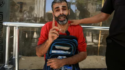 Palestinian father Youssef Salman mourns as he carries the school bag of his eight-year-old son Jad, who was killed in an Israeli strike on the Jabalia refugee camp, according to medics, at Al-Shifa hospital in Gaza City, June 8, 2026. REUTERS/Dawoud Abu Alkas   TPX IMAGES OF THE DAY