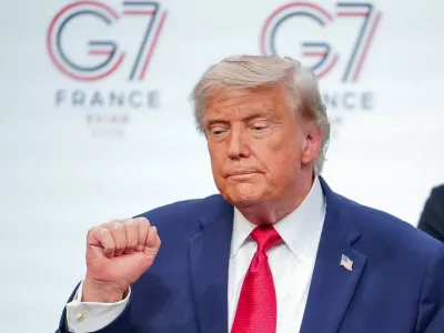 U.S. President Donald Trump gestures as he leaves the stage after a media conference at the end of the G7 summit in Evian-les-Bains, France, Wednesday, June 17, 2026. (AP Photo/Vadim Ghirda)