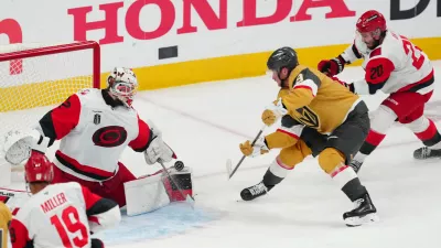 Jun 9, 2026; Las Vegas, Nevada, USA; Carolina Hurricanes goaltender Brandon Bussi (32) stops a shot by Vegas Golden Knights center Jack Eichel (9) during the 3rd period in game four of the 2026 Stanley Cup Final at T-Mobile Arena. Mandatory Credit: Stephen R. Sylvanie-Imagn Images