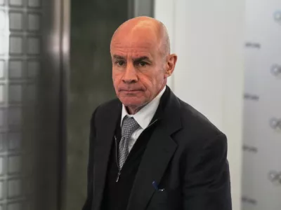 FILE - Candidate to the presidency of the International Olympic Committee Johan Eliasch arrives at the mixed zone during a break of the 144th session, which will elect the new IOC President, in Costa Navarino, western Greece, March 19, 2025. (AP Photo/Thanassis Stavrakis, File)