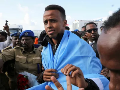 Somali referee Omar Abdulkadir Artan, who had been expected to officiate at matches during the 2026 FIFA World Cup but was denied entry to the United States, is received as he arrives at the Aden Abdulle Osman International Airport in Mogadishu, Somalia June 10, 2026. REUTERS/Feisal Omar
