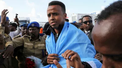 Somali referee Omar Abdulkadir Artan, who had been expected to officiate at matches during the 2026 FIFA World Cup but was denied entry to the United States, is received as he arrives at the Aden Abdulle Osman International Airport in Mogadishu, Somalia June 10, 2026. REUTERS/Feisal Omar