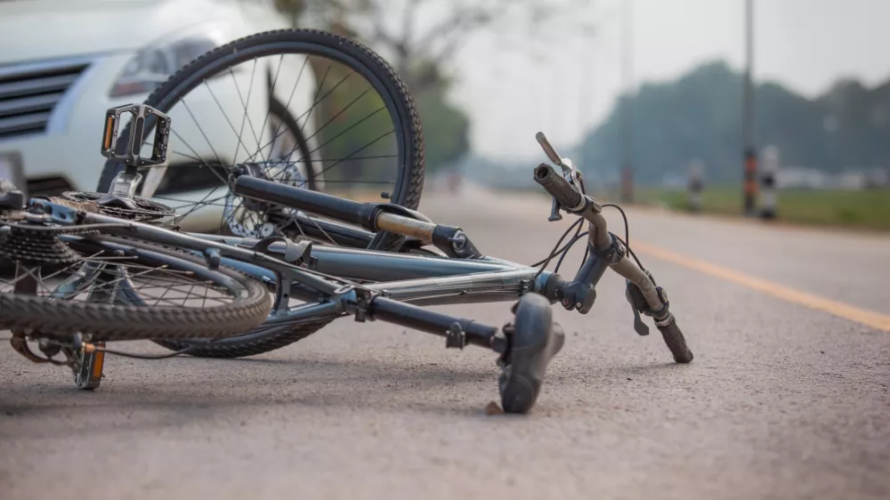 Accident car crash with bicycle on road because drunk driving.