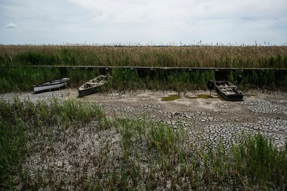 Boats in a dried-up harbour at the drying Lake Velence, Hungary's third-largest lake, where years of drought and insufficient water retention have led to critically low water levels, in Pakozd, Hungary, June 9, 2026. REUTERS/Marton Monus