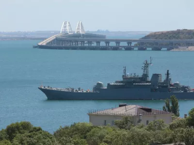 FILE - A Russian military ship transports cars and people from&nbsp;the Russian mainland to&nbsp;the Crimean Peninsula over the Kerch Strait on Monday, July 17, 2023. (AP Photo, File)