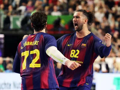 Handball - EHF FINAL4 Men's Handball Champions League Finals - Aalborg Handbold v Barca - Lanxess Arena, Cologne, Germany - June 13, 2026 Barca's Luis Frade celebrates with Ludovic Fabregas REUTERS/Leon Kuegeler