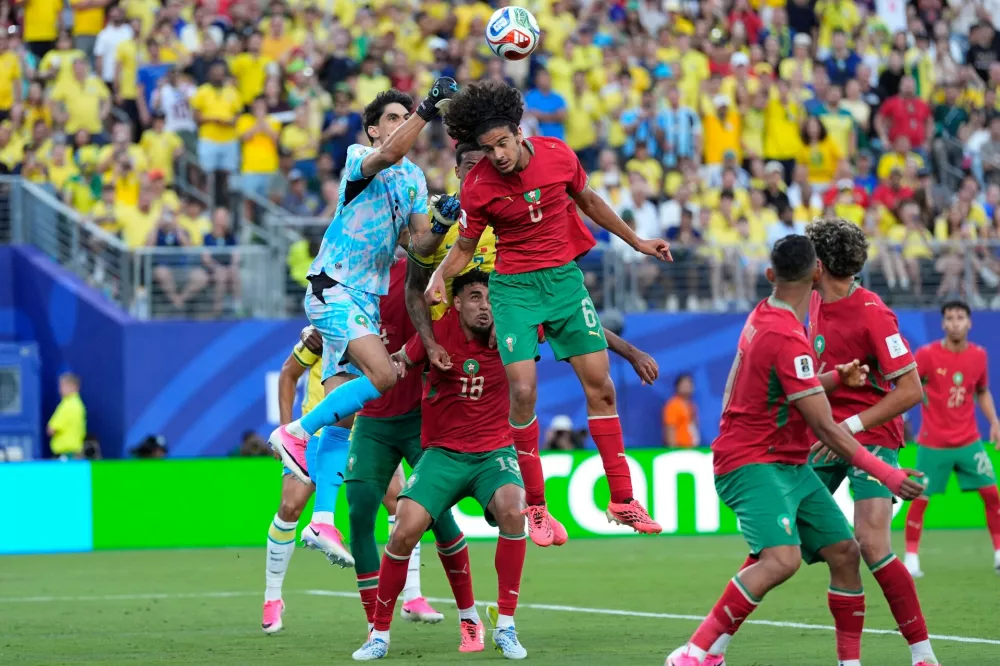 Morocco goalkeeper Yassine Bounou (1) punches the ball during the World Cup Group C soccer match between Brazil and Morocco in East Rutherford, N.J., near New York, Saturday, June 13, 2026. (AP Photo/Yuki Iwanmura)