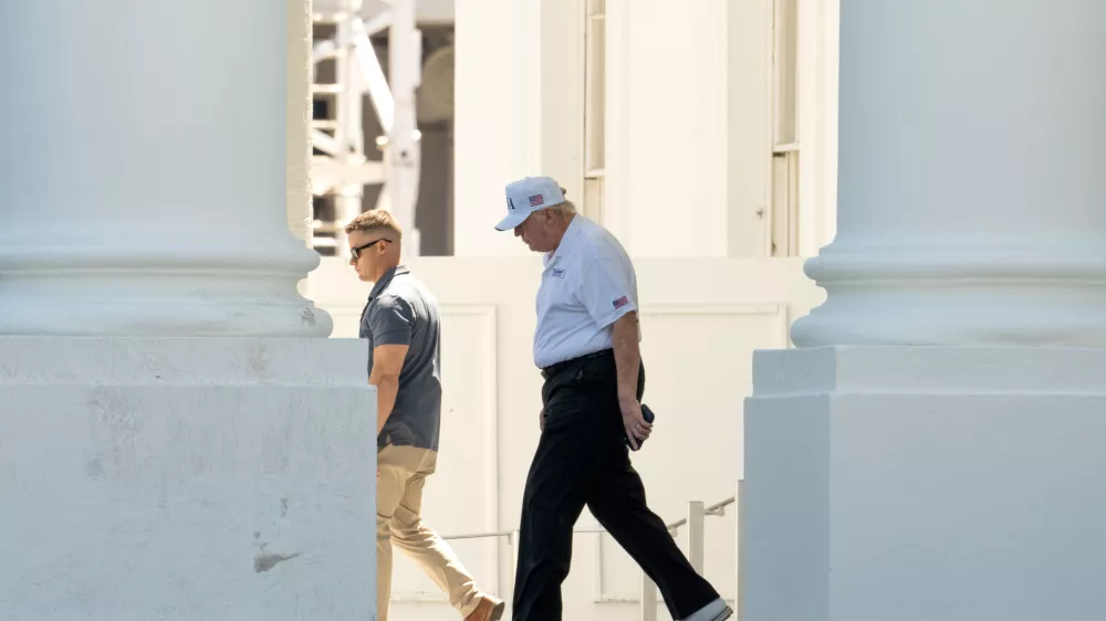 President Donald Trump walks to board his limousine at the North Portico of the White House, Saturday, June 13, 2026, in Washington. (AP Photo/Mark Schiefelbein)