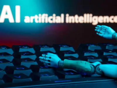 FILE PHOTO: A message reading "AI artificial intelligence," a keyboard and robot hands are seen in this illustration created on January 27, 2025. REUTERS/Dado Ruvic/Illustration/File Photo