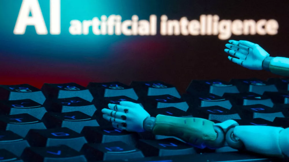 FILE PHOTO: A message reading "AI artificial intelligence," a keyboard and robot hands are seen in this illustration created on January 27, 2025. REUTERS/Dado Ruvic/Illustration/File Photo