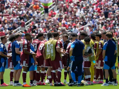 Qatari players take a water break during the World Cup Group B soccer match between Qatar and Switzerland in Santa Clara, Calif., near San Francisco, Saturday, June 13, 2026. (AP Photo/Eugene Hoshiko)