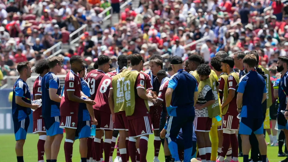 Qatari players take a water break during the World Cup Group B soccer match between Qatar and Switzerland in Santa Clara, Calif., near San Francisco, Saturday, June 13, 2026. (AP Photo/Eugene Hoshiko)