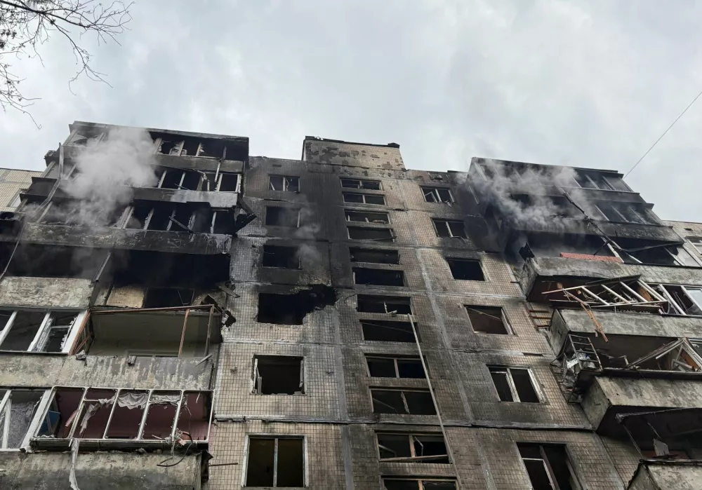 An apartment building hit during a Russian missile and drone strikes, amid Russia's attack on Ukraine, in Kyiv, Ukraine June 15, 2026. Picture taken with a mobile phone. REUTERS/Stringer