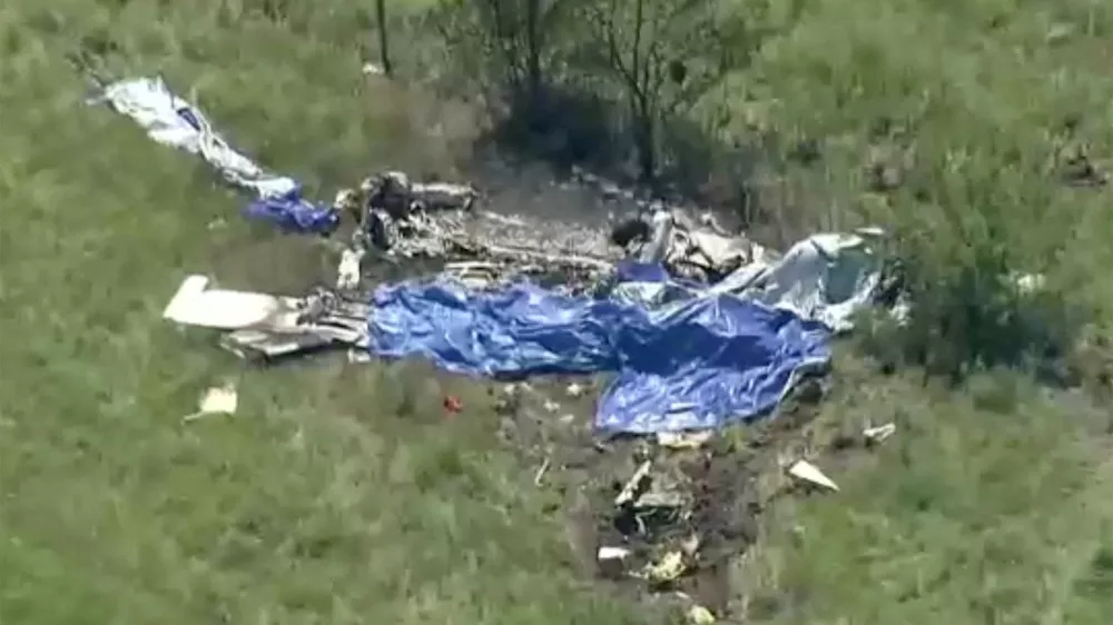 Wreckage lies in a field next to Butler Memorial Airport after a plane carrying skydivers crashed in Butler, Missouri, U.S., June 14, 2026 in a still image from video. ABC Affiliate KMBC via REUTERS. NO RESALES. NO ARCHIVES. THIS IMAGE HAS BEEN SUPPLIED BY A THIRD PARTY. MANDATORY CREDIT   TPX IMAGES OF THE DAY