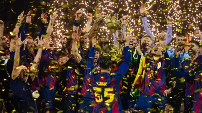 Barcelona players celebrate winning the men's handball Champions League final match between F&uuml;chse Berlin and FC Barcelona in Cologne, Germany, Sunday June 14, 2026. (Marius Becker/dpa via AP)