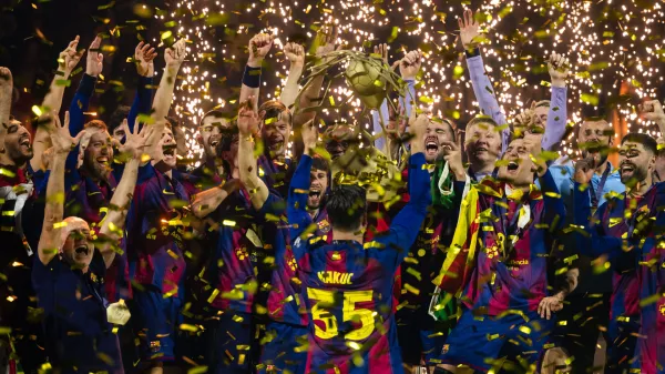 Barcelona players celebrate winning the men's handball Champions League final match between F&uuml;chse Berlin and FC Barcelona in Cologne, Germany, Sunday June 14, 2026. (Marius Becker/dpa via AP)
