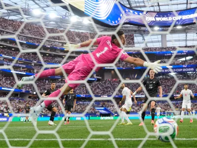 New Zealand goalkeeper Max Crocombe (1) is beaten by a header from Iran's Mohammad Mohebbi (8) to scores their second goal during the World Cup Group G soccer match between Iran and New Zealand in Inglewood, Calif., near Los Angeles, Monday, June 15, 2026. (AP Photo/Mark J. Terrill)