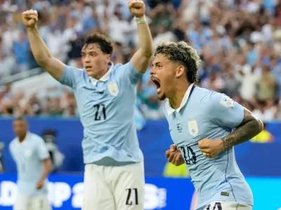 Uruguay's Maxi Araujo celebrates scoring his side's opening goal against Saudi Arabia during a World Cup Group H soccer match in Miami Gardens, Fla., Monday, June 15, 2026. (AP Photo/Lynne Sladky)